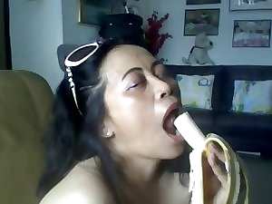 THAI Slutty mom SHOWING HER Mega tits AND Licking BANANA